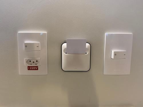 three electrical outlets on a wall in a room at SALINAS EXCLUSIVE RESORT in Salinópolis