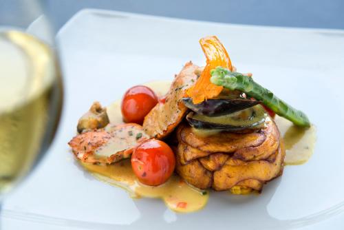 a plate of food with meat and vegetables on it at Labadi Beach Hotel in Accra