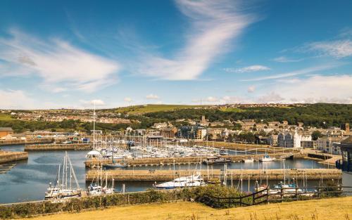 a group of boats docked in a marina at Georgian House Hotel in Whitehaven