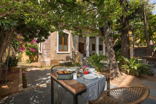 a table with a bowl of food on it at La Villa in Puducherry