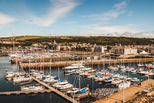 a bunch of boats docked in a harbor at Georgian House Hotel in Whitehaven