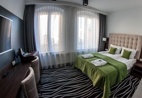 Katil atau katil-katil dalam bilik di No1 Bed&Breakfast Restauracja ŚNIADANIE I PARKING W CENIE!