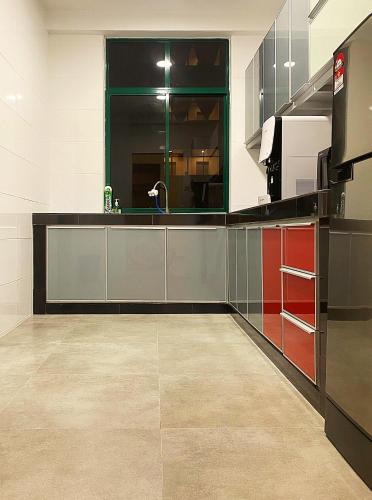 a kitchen with a sink and a counter top at Amadel Residence 爱媄德民宿 11 in Melaka