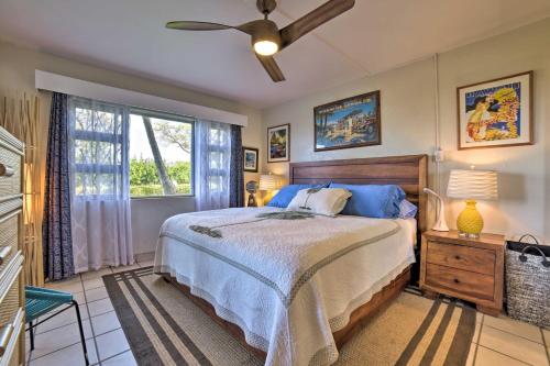 a bedroom with a large bed and a window at Ocean-View Kihei Condo with Lanai Steps to Beach! in Kihei