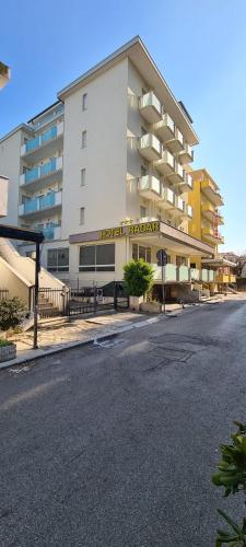 a building with a hotel on the side of a street at Hotel Radar in Rimini