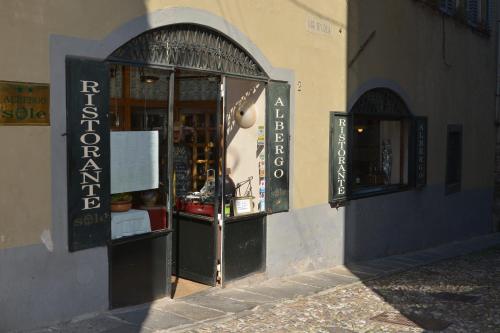 a store front with an entrance to a store at Il Sole in Bergamo