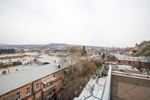 a view of a city from the roof of a building at Hotel Flower in Tbilisi City