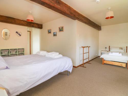 a bedroom with two beds in a room at Thistle in Selby