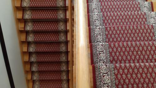 two rows of red and white carpet on a shelf at Resort Kasprowy Wierch in Zakopane