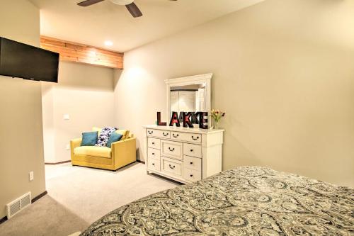 a bedroom with a dresser and a mirror at Luxurious Liberty Lake Hideaway with Hot Tub! in Liberty Lake