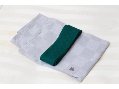 a white napkin with a green tie on it at Fuji Green Hotel - Vacation STAY 18928v in Fuji
