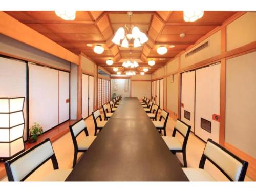 a long conference room with a long table and chairs at Fuji Green Hotel - Vacation STAY 18934v in Fuji