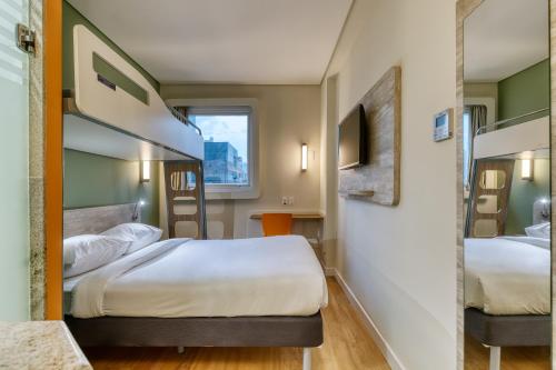 Postel nebo postele na pokoji v ubytování ibis budget BH Savassi