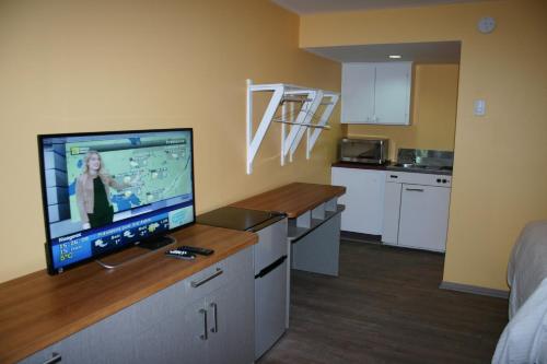 Dapur atau dapur kecil di Motel des Pentes et Suites