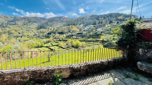 a balcony with a view of a valley at Casa da Avó in Arcos de Valdevez