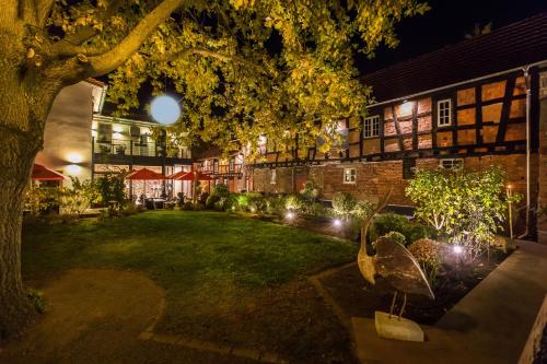 a courtyard of a building at night with lights at Farmerhaus-Lodge in Groß-Umstadt