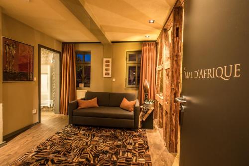 a living room with a couch and a door at Farmerhaus-Lodge in Groß-Umstadt