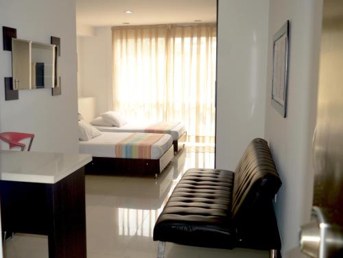 Postel nebo postele na pokoji v ubytování Hotel Mare Apartasuite