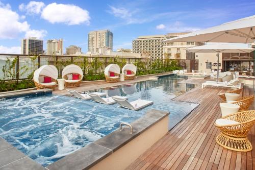 a swimming pool on top of a building at Hyatt Centric Waikiki Beach in Honolulu