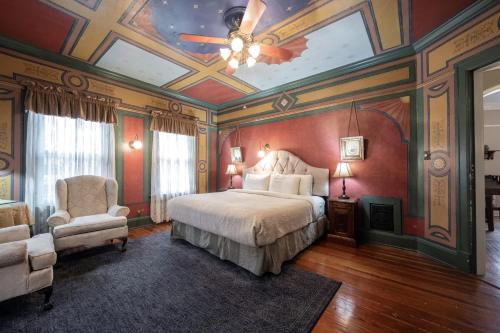 a bedroom with a bed and a ceiling at Stone Soup Inn in Indianapolis