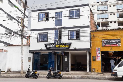two motorcycles parked in front of a building at Hotel Mi Palermo in Bucaramanga