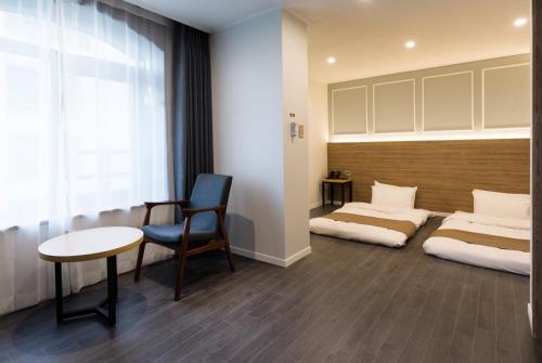 Ένα ή περισσότερα κρεβάτια σε δωμάτιο στο Casaloma Hotel