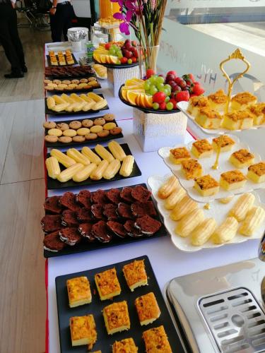a table with many different types of food on it at Sky Beach D20 Nha Trang in Nha Trang