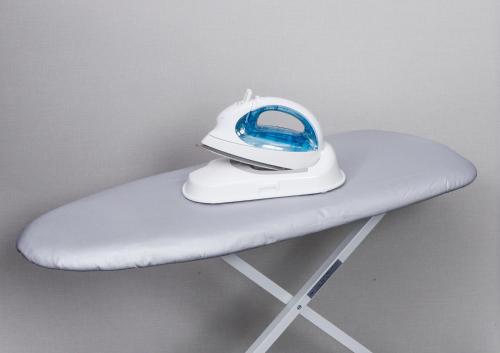 a iron is sitting on top of a chair at Hotel Code Shinsaibashi in Osaka