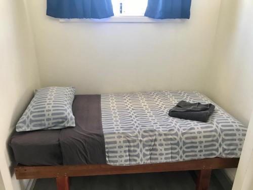 En eller flere senge i et værelse på Oceanside Village