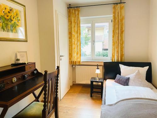 a bedroom with a bed and a window at Landgasthof Kaiser in Bieringen