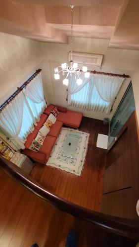an overhead view of a living room with a couch at Star House in Tianfu