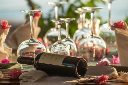 a bottle of wine sitting on a table with wine glasses at Side Beach Club in Side
