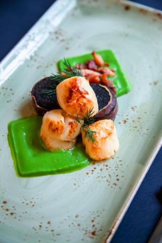 a plate of food with shrimp and vegetables on it at Georgian House Hotel in Whitehaven