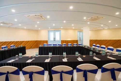 a meeting room with a long table and chairs at Ramee Royal Resort & Spa - Udaipur in Udaipur