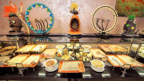 a display case filled with different types of food at Wyndham Batumi in Batumi