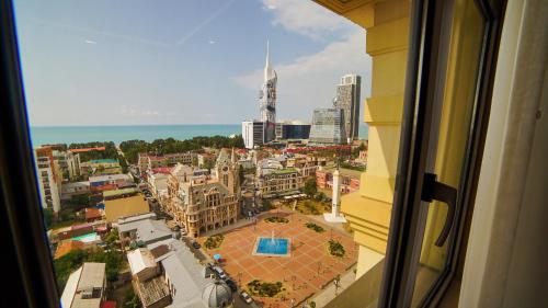 a view of a city from a window at Wyndham Batumi in Batumi