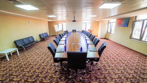 a large conference room with a long table and chairs at Wyndham Batumi in Batumi