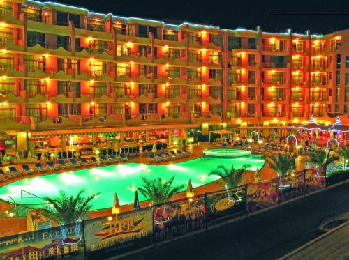 a large hotel with a large pool in front of it at Grenada Hotel in Sunny Beach