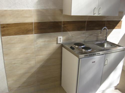 Kuchyňa alebo kuchynka v ubytovaní Parti Apartman