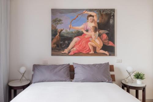 En eller flere senger på et rom på iFlat Navona White and Stylish Apartment