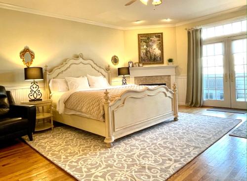 a bedroom with a white bed and a fireplace at Inn on Main Hotel in Manasquan