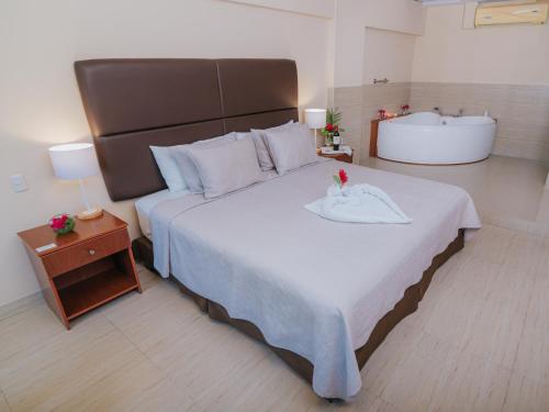 Cama o camas de una habitación en El Angolo Piura