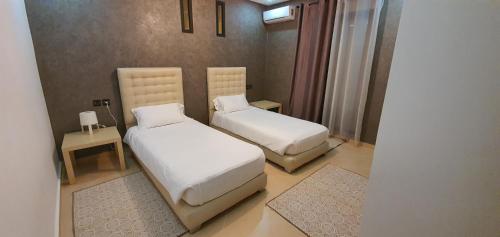 Ένα ή περισσότερα κρεβάτια σε δωμάτιο στο Villa Nour