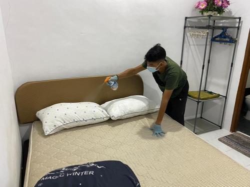 Ένα ή περισσότερα κρεβάτια σε δωμάτιο στο LMS homestay