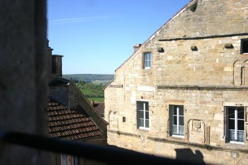 a view from a window of an old building at SY-la terrasse in Vézelay