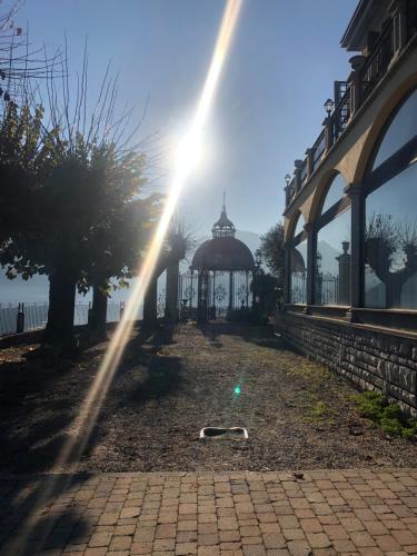 a beam of sunlight shines on a gazebo at Liza's Suite's - Room's with a View in Sala Comacina
