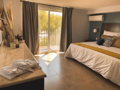 Postel nebo postele na pokoji v ubytování Saint George Hotel - Spa & Temazcal