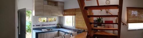 a small kitchen with a sink and a sinkessment at Cabaña Los Pinos in Villa Icho Cruz