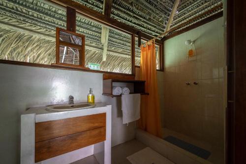 a bathroom with a sink and a shower at Nicky Amazon Lodge in Marian
