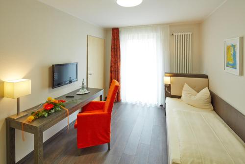 TV a/nebo společenská místnost v ubytování Hotel FIT